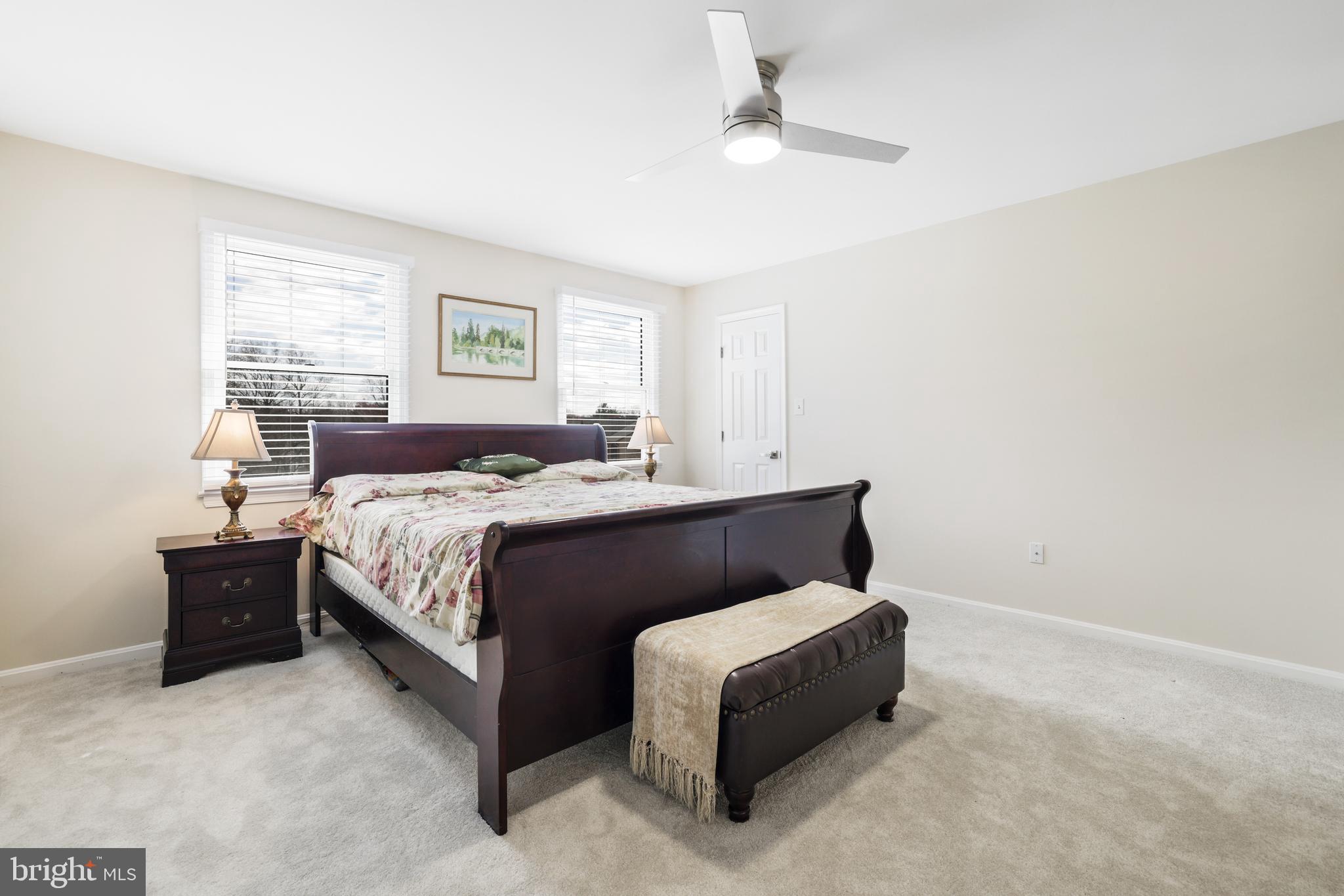 15532 Quince Ridge Lane North Potomac, MD 20878 - Photo 20 of 50 a bedroom with a bed lamp and window