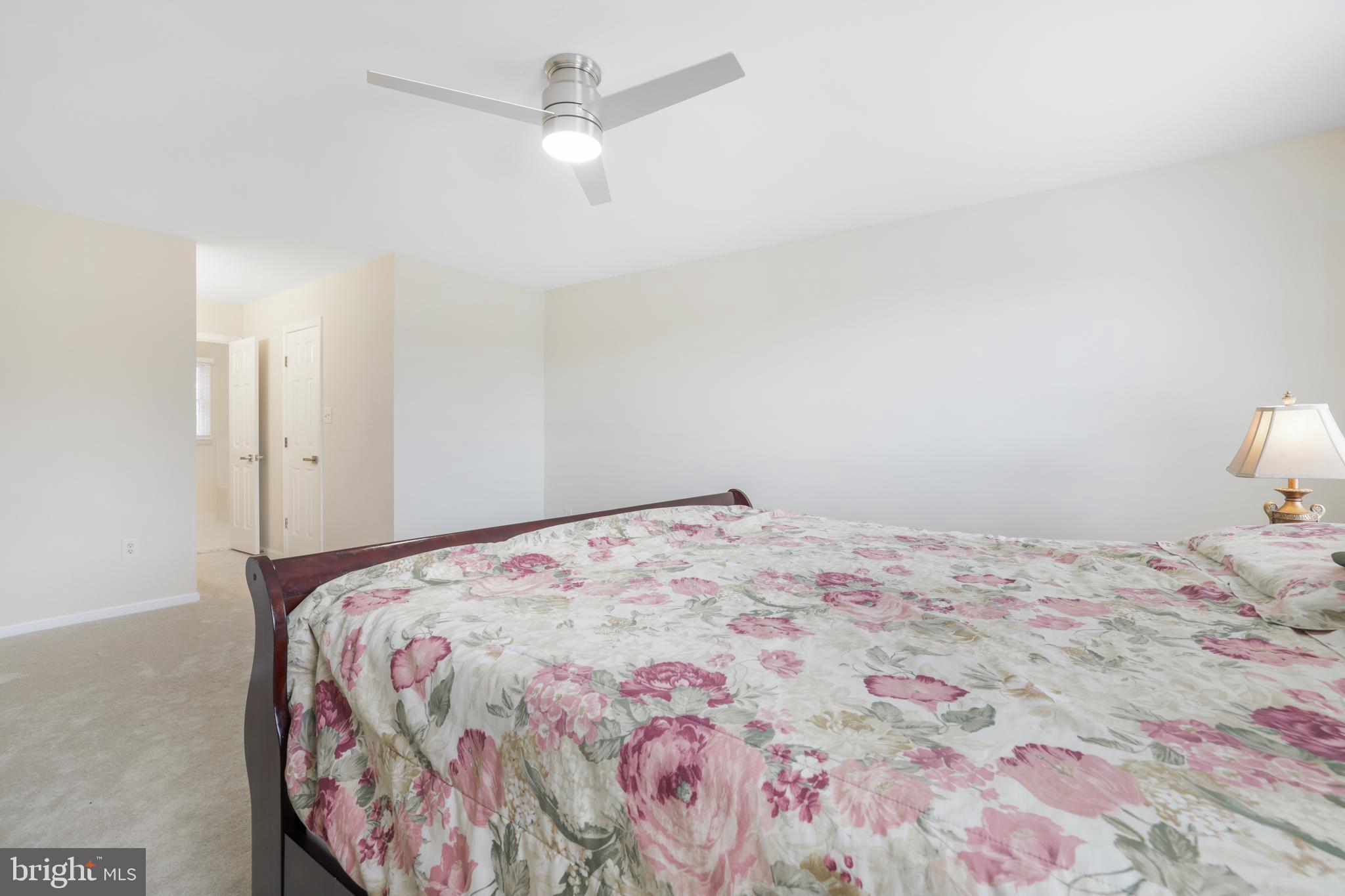 15532 Quince Ridge Lane North Potomac, MD 20878 - Photo 21 of 50 a bedroom with a bed and a dresser