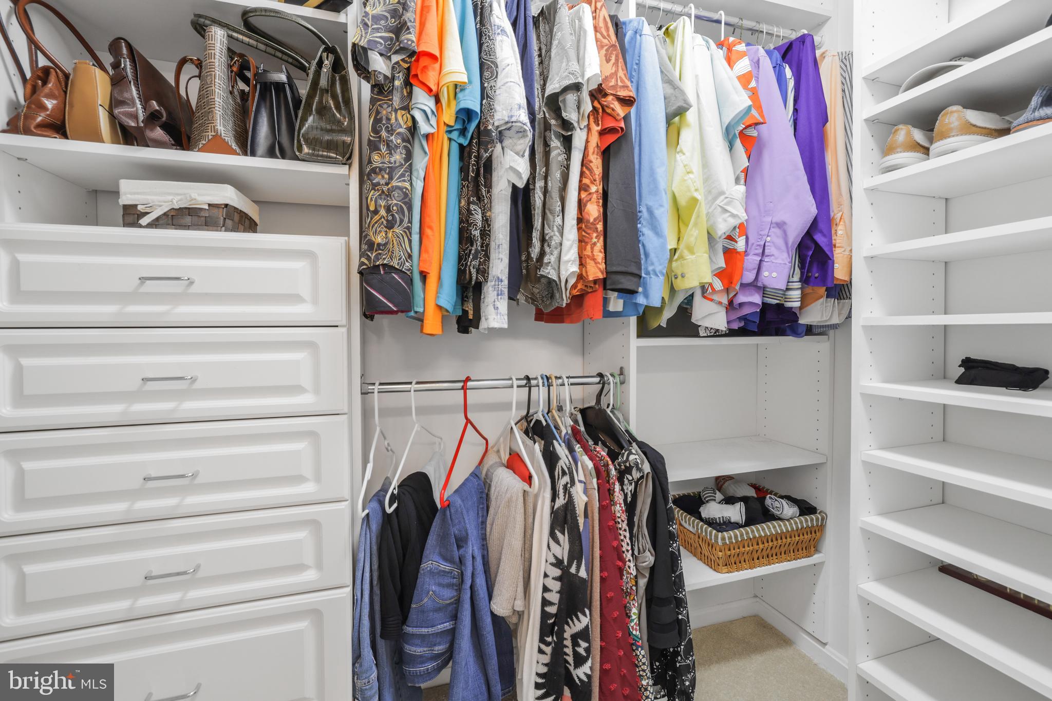 15532 Quince Ridge Lane North Potomac, MD 20878 - Photo 23 of 50 a view of walk in closet with clothes and shoes
