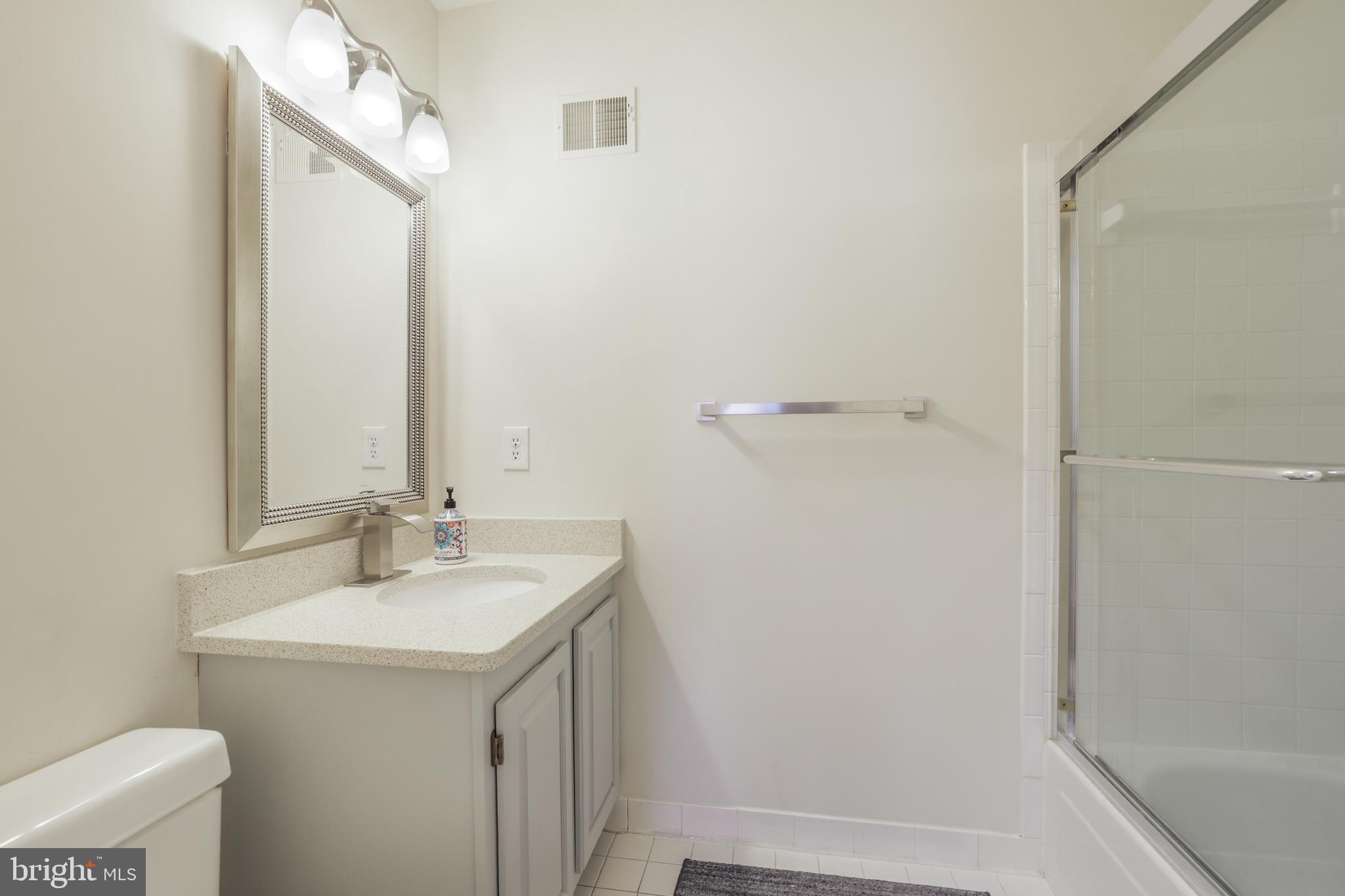 15532 Quince Ridge Lane North Potomac, MD 20878 - Photo 29 of 50 a bathroom with a sink and a mirror