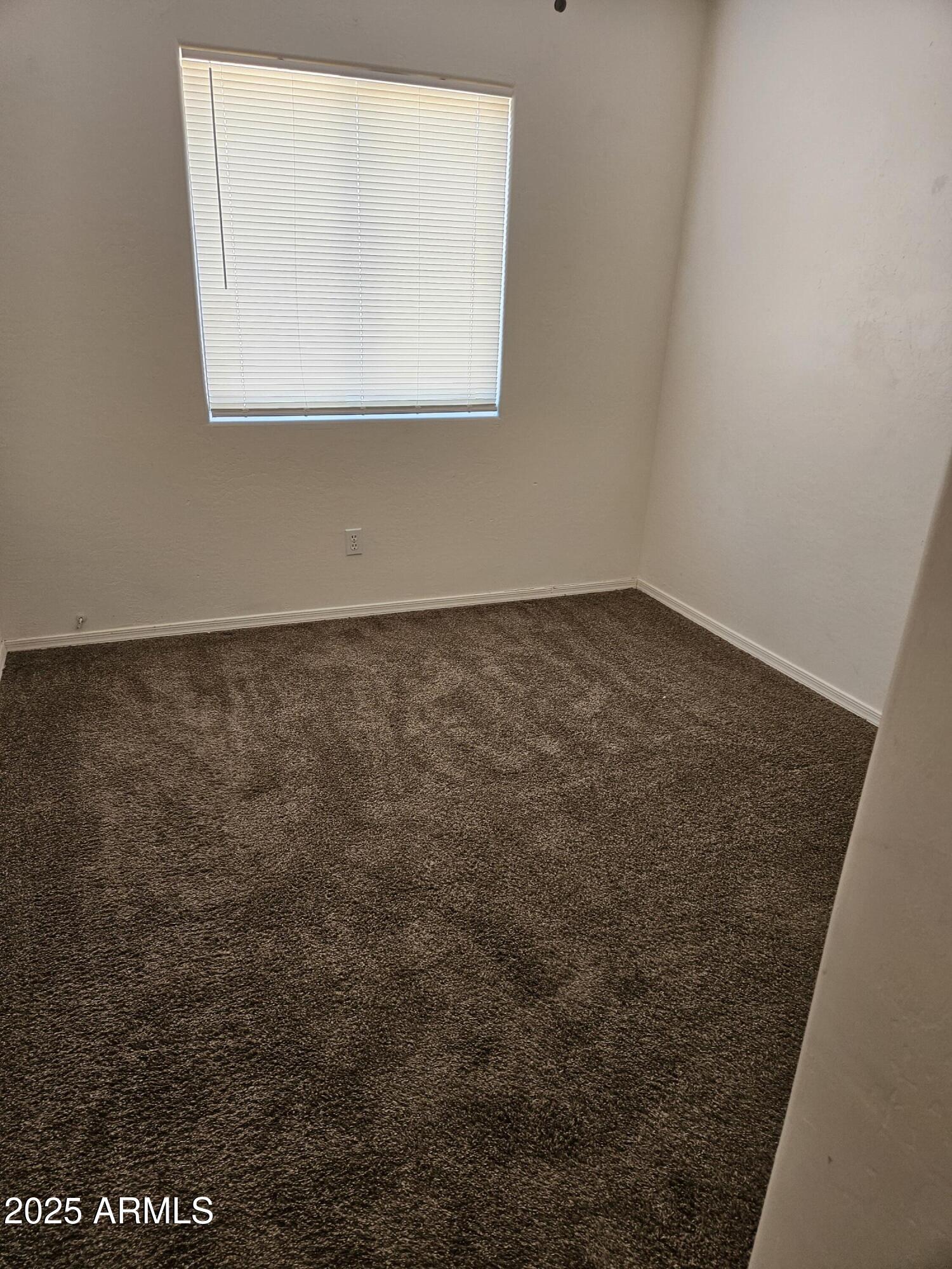 15676 South Moon Valley Road, Unit 2 Arizona City, AZ 85123 - Photo 4 of 5 a view of a small space with window
