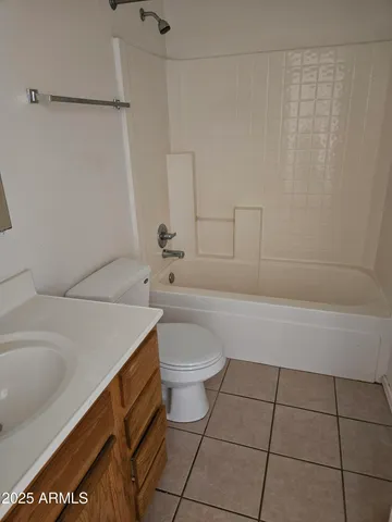 a bathroom with a sink a toilet and bathtub
