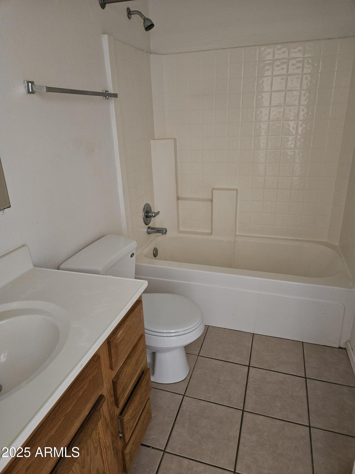 15676 South Moon Valley Road, Unit 2 Arizona City, AZ 85123 - Photo 5 of 5 a bathroom with a sink a toilet and bathtub