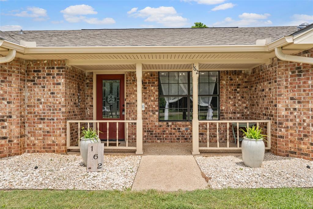 162 High Ridge Drive Bruceville, TX 76630 - Photo 7 of 40 a front view of a house with a yard