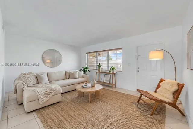 a living room with furniture and a table