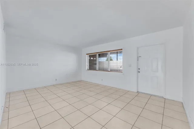 a view of an empty room and window