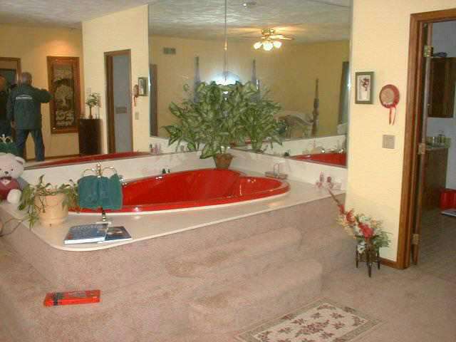 N3134 Aebly Road Monroe, WI 53566 - Photo 8 of 8 a bathroom with a tub sink and mirror