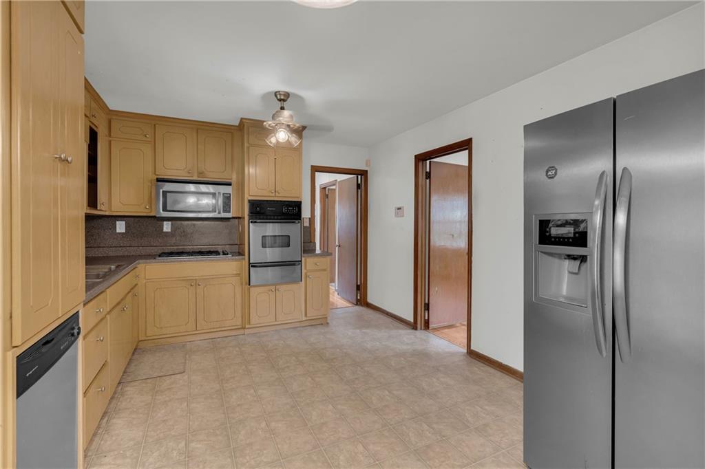 1620 Rock Cut Road Conley, GA 30288 - Photo 12 of 43 a large kitchen with cabinets and stainless steel appliances