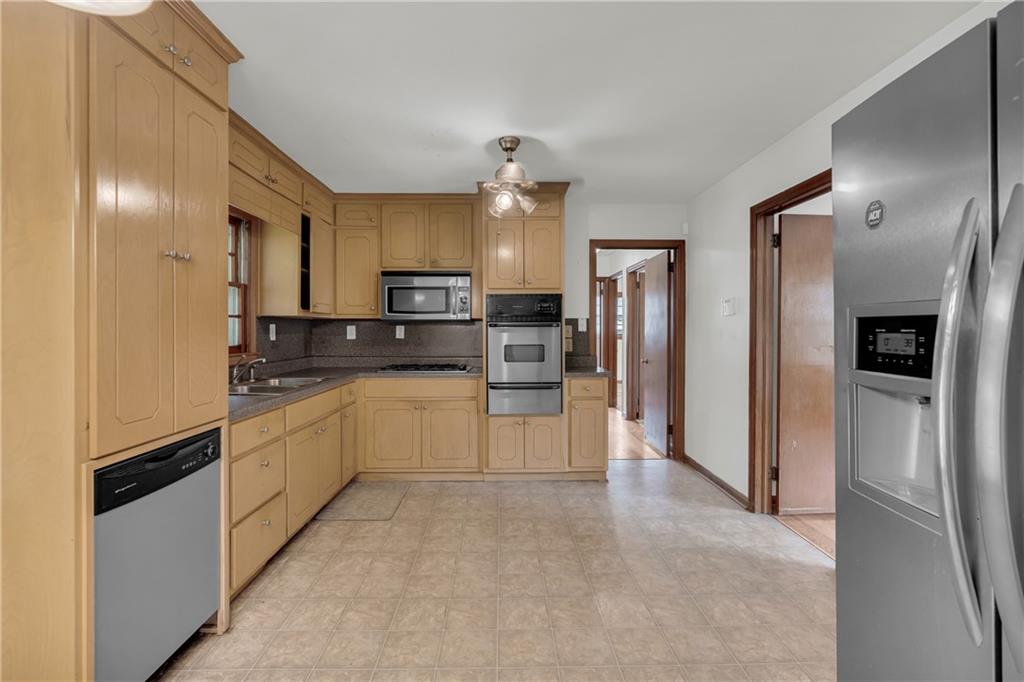 1620 Rock Cut Road Conley, GA 30288 - Photo 13 of 43 a large kitchen with cabinets and stainless steel appliances