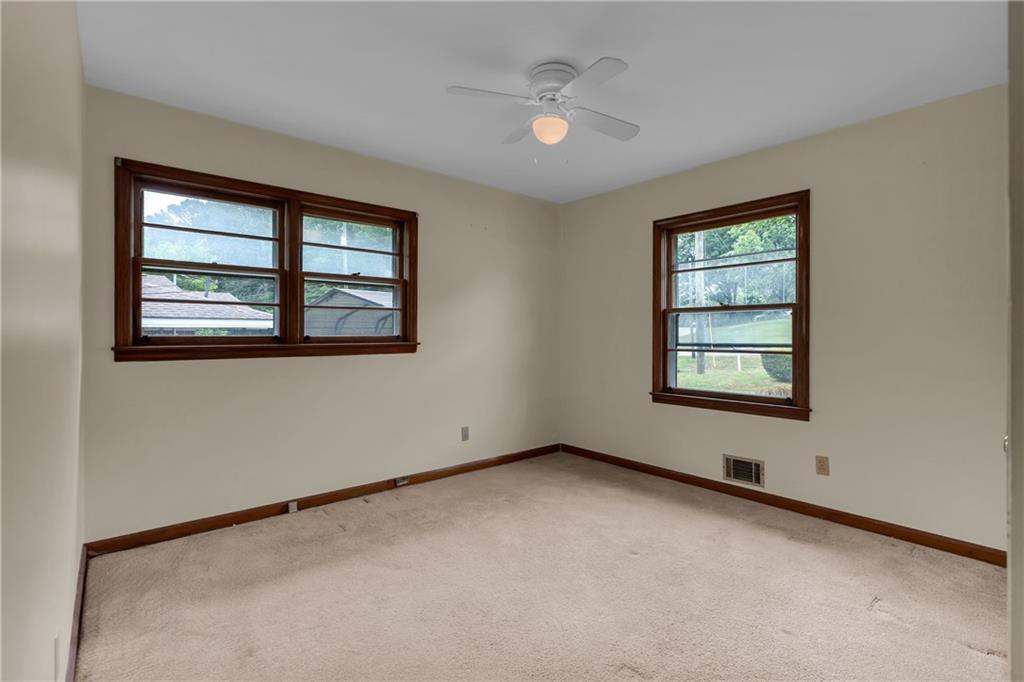 1620 Rock Cut Road Conley, GA 30288 - Photo 22 of 43 an empty room with a window