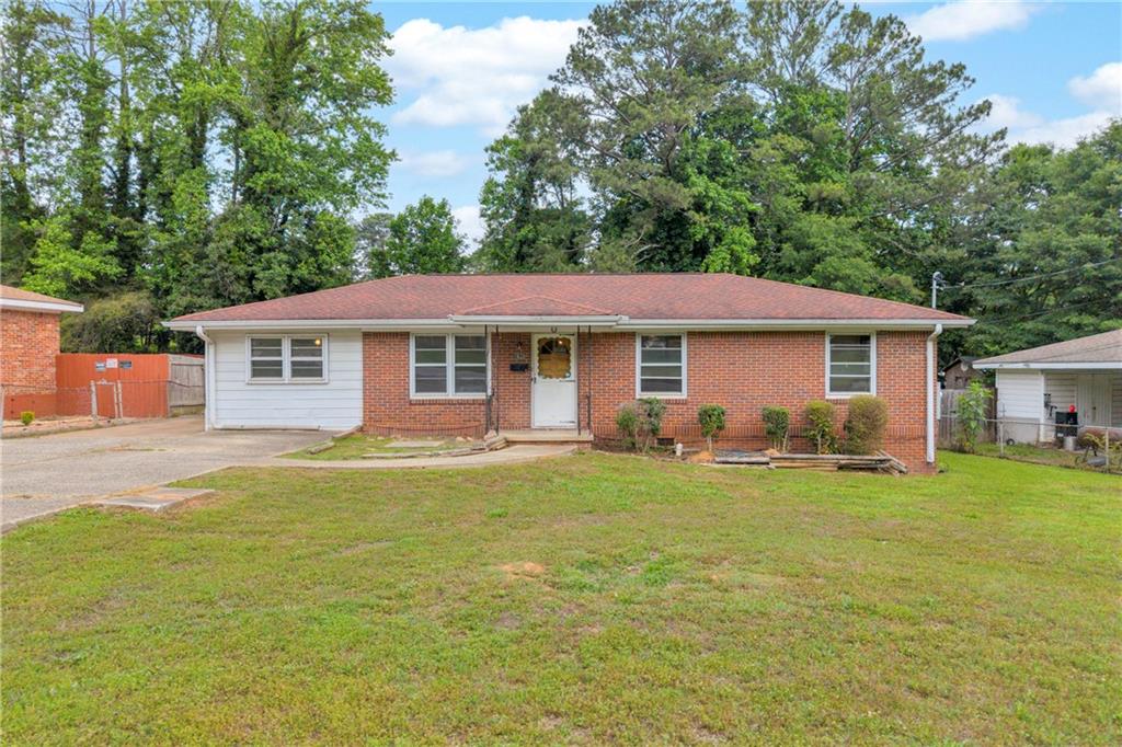 1620 Rock Cut Road Conley, GA 30288 - Photo 3 of 43 a front view of a house with a garden