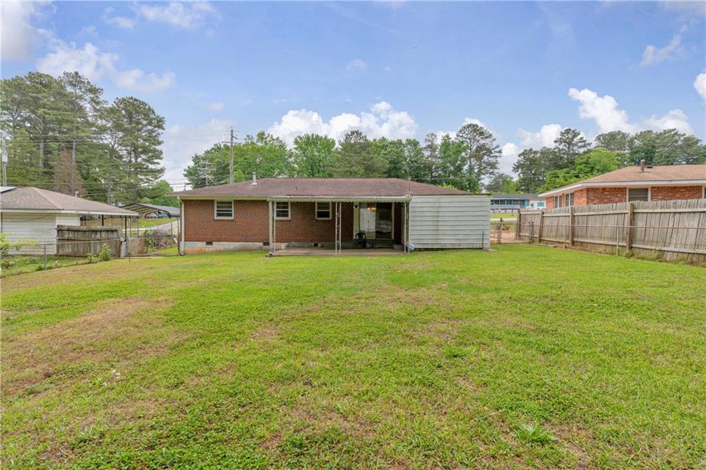 1620 Rock Cut Road Conley, GA 30288 - Photo 33 of 43 a view of a house with a yard and sitting area
