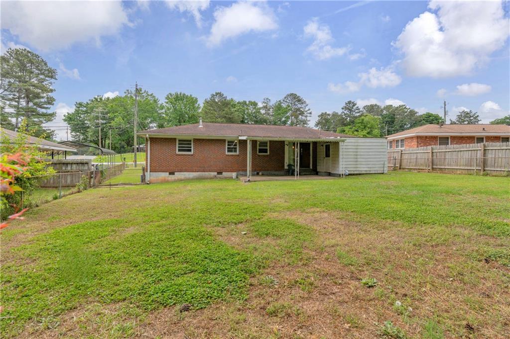 1620 Rock Cut Road Conley, GA 30288 - Photo 34 of 43 a view of a house with a yard and sitting area