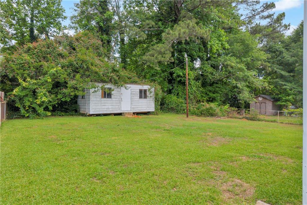 1620 Rock Cut Road Conley, GA 30288 - Photo 35 of 43 a view of a backyard with a garden