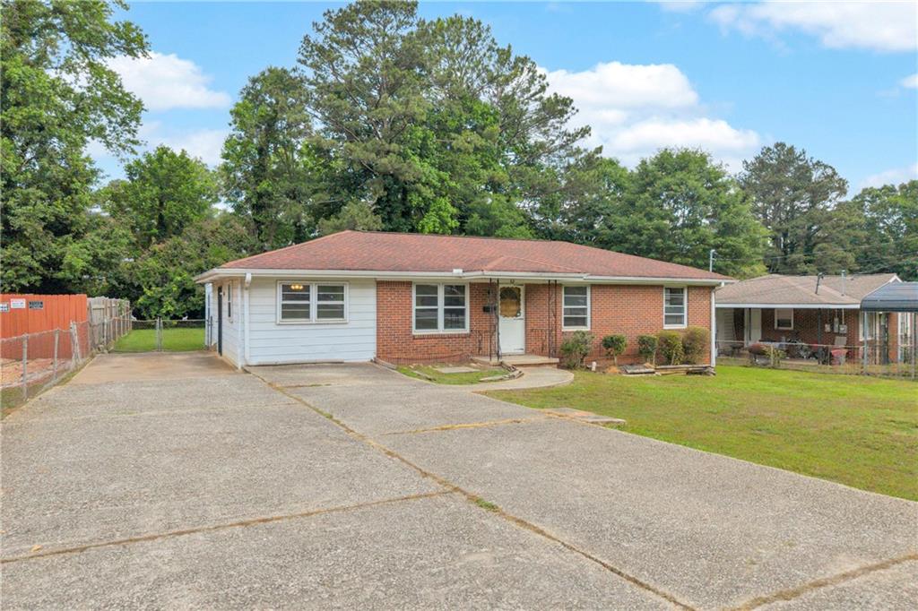 1620 Rock Cut Road Conley, GA 30288 - Photo 4 of 43 a front view of a house with a yard