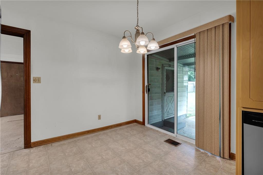 1620 Rock Cut Road Conley, GA 30288 - Photo 10 of 43 a view of a chandelier fan and fire place
