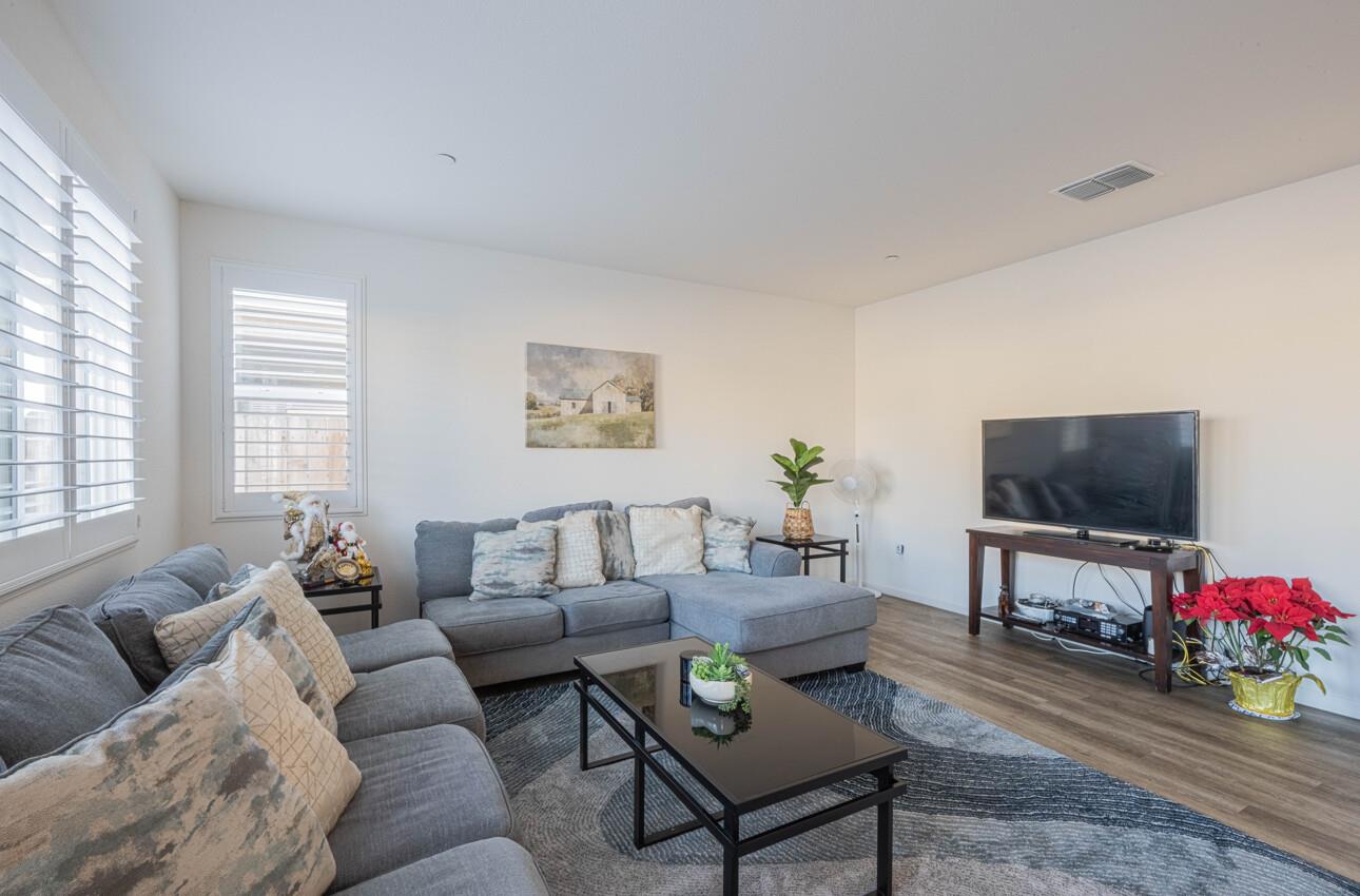 570 Tankersley Street Soledad, CA 93960 - Photo 11 of 64 a living room with furniture a flat screen tv and a window