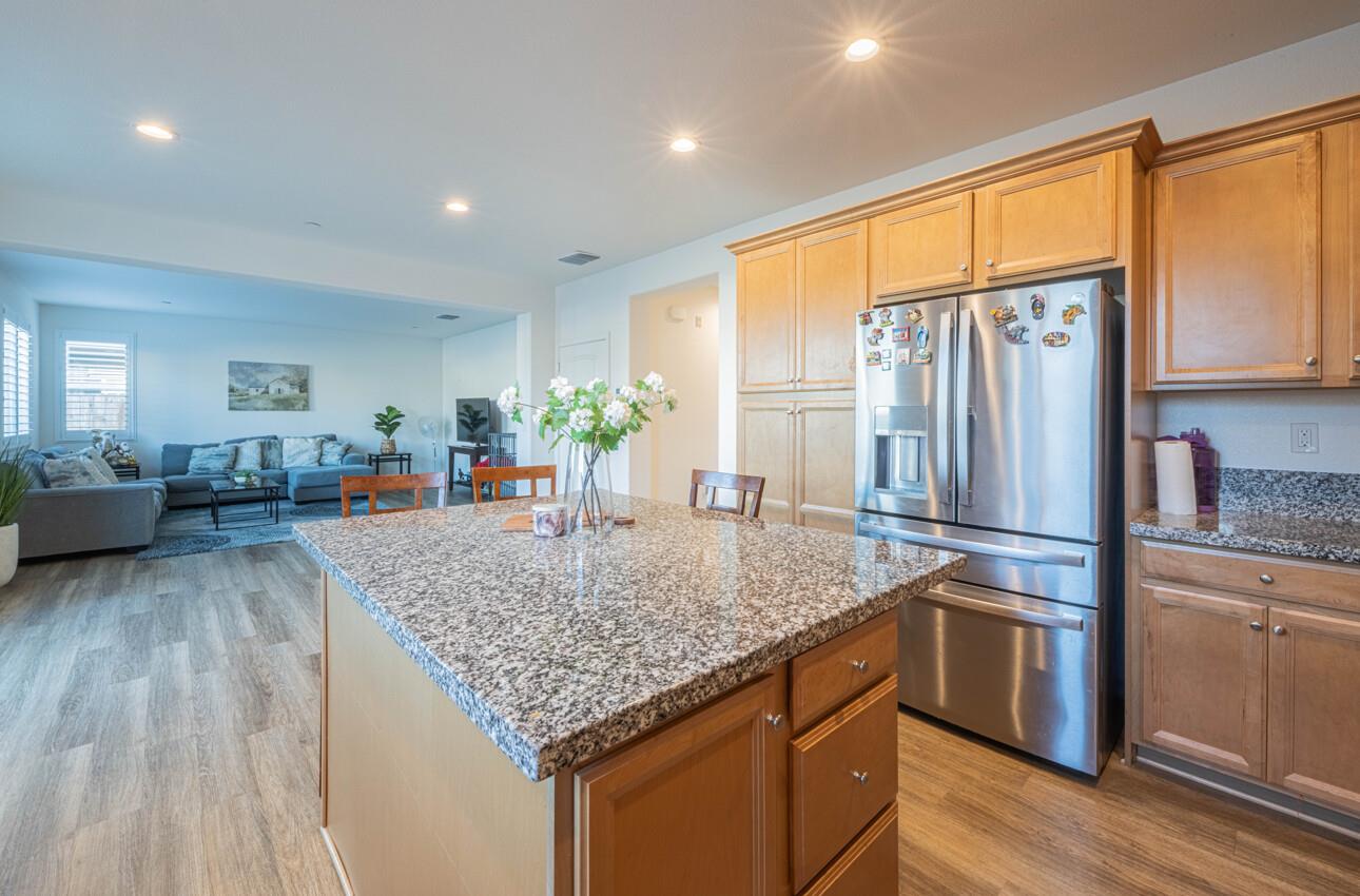 570 Tankersley Street Soledad, CA 93960 - Photo 18 of 64 a kitchen with stainless steel appliances granite countertop a refrigerator sink and cabinets