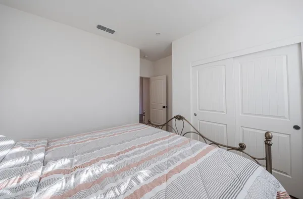 a view of an empty room and a bathroom
