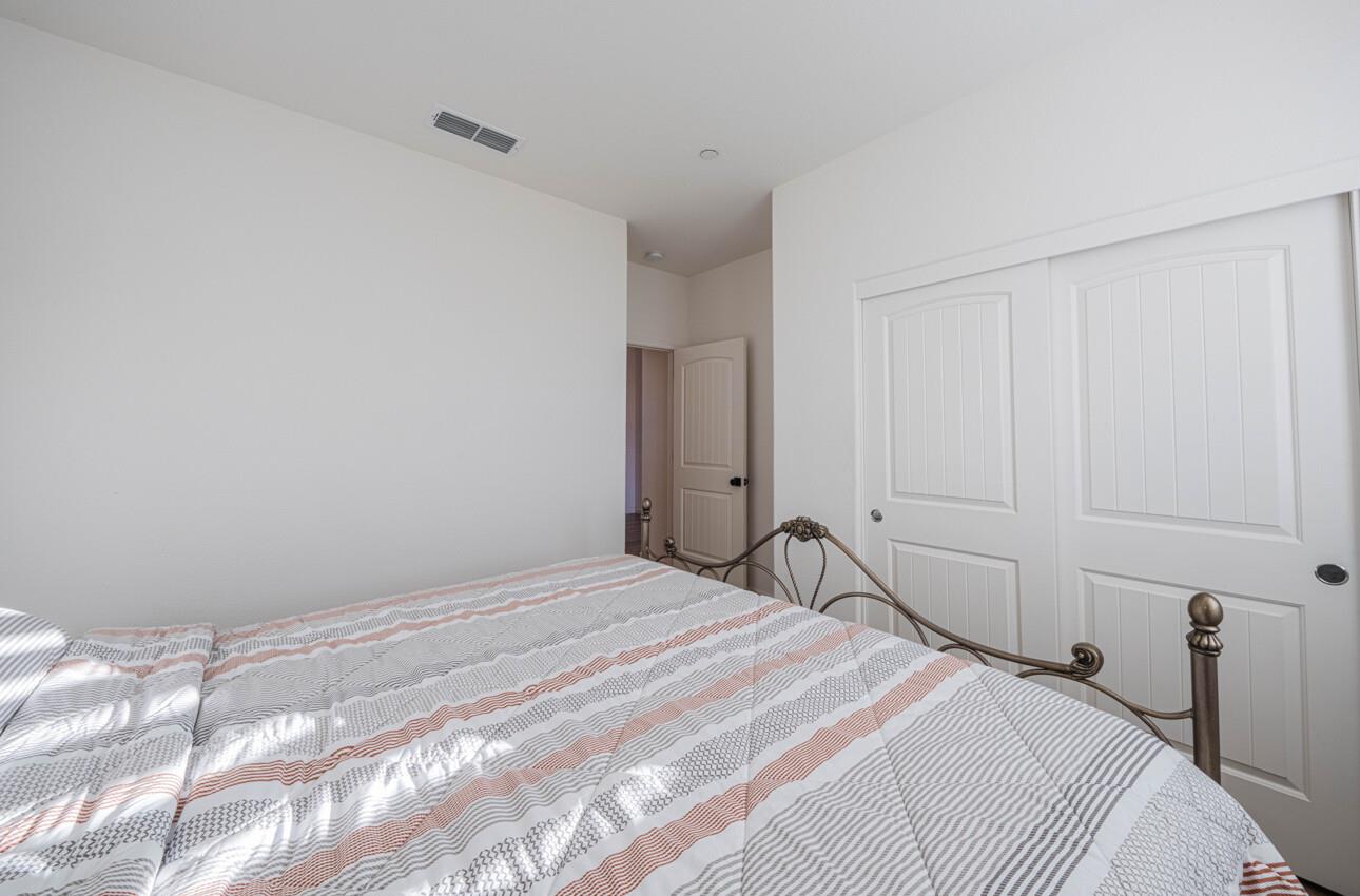 570 Tankersley Street Soledad, CA 93960 - Photo 32 of 64 a bedroom with a bed and a window