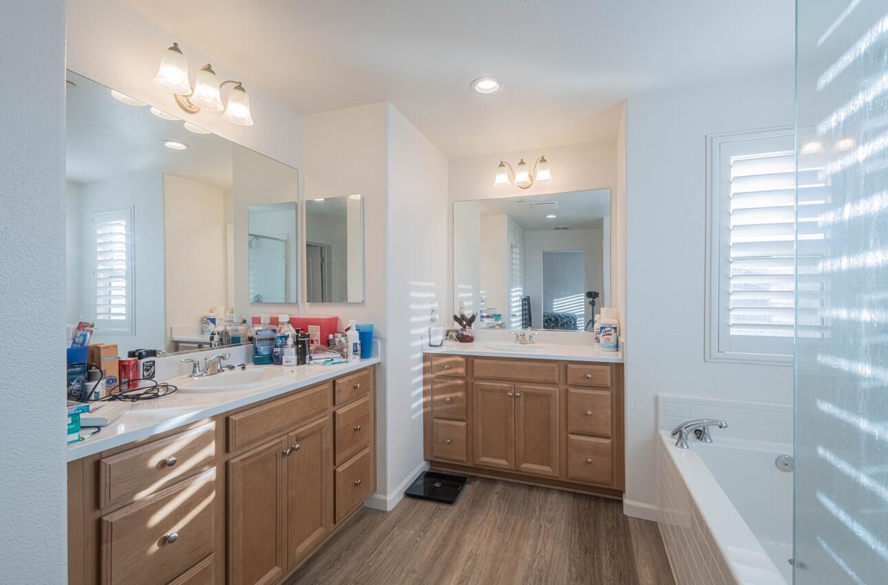 570 Tankersley Street Soledad, CA 93960 - Photo 42 of 64 a large bathroom with a tub a sink double vanity granite and a large mirror