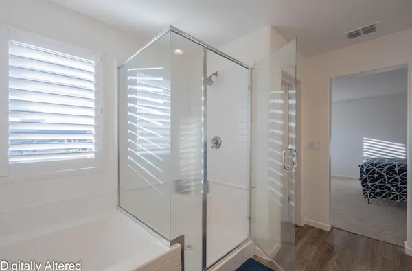 a bedroom with a bed and a computer on it