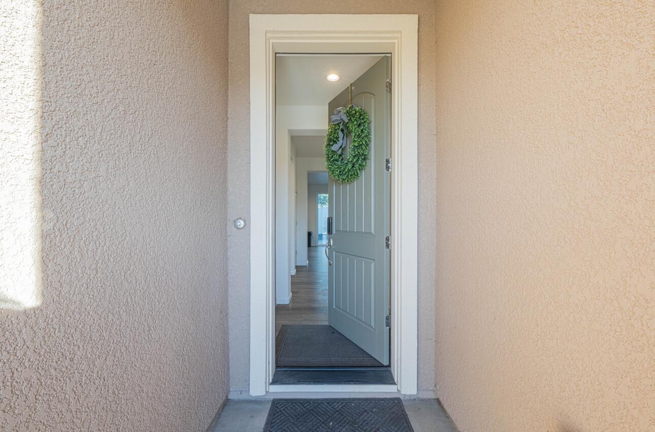 570 Tankersley Street Soledad, CA 93960 - Photo 5 of 64 a view of a hallway with wooden floor