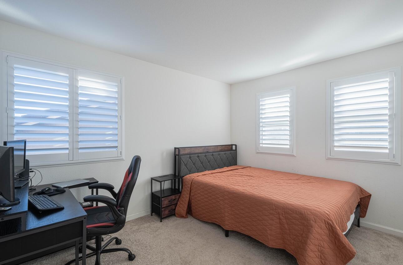 570 Tankersley Street Soledad, CA 93960 - Photo 56 of 64 a bedroom with a bed and a desk