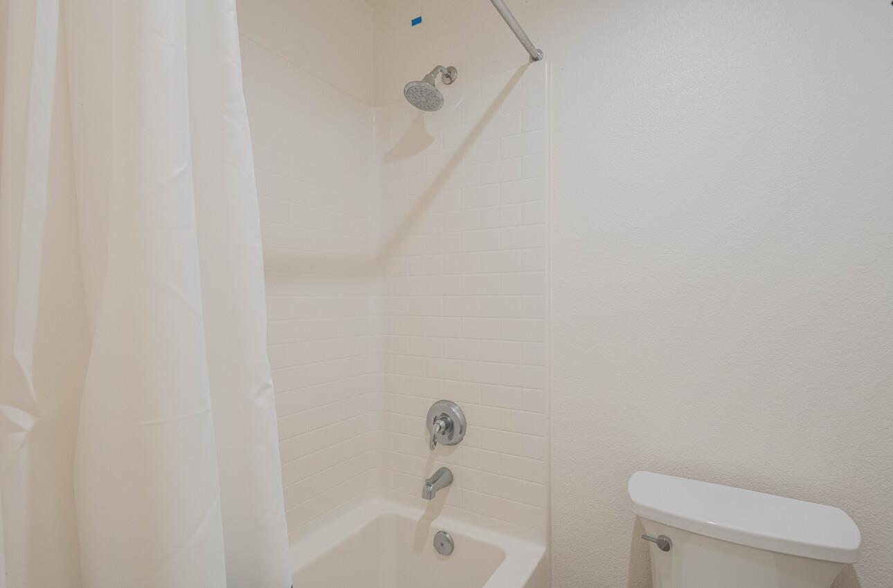 570 Tankersley Street Soledad, CA 93960 - Photo 62 of 64 a white toilet sitting next to a bath tub