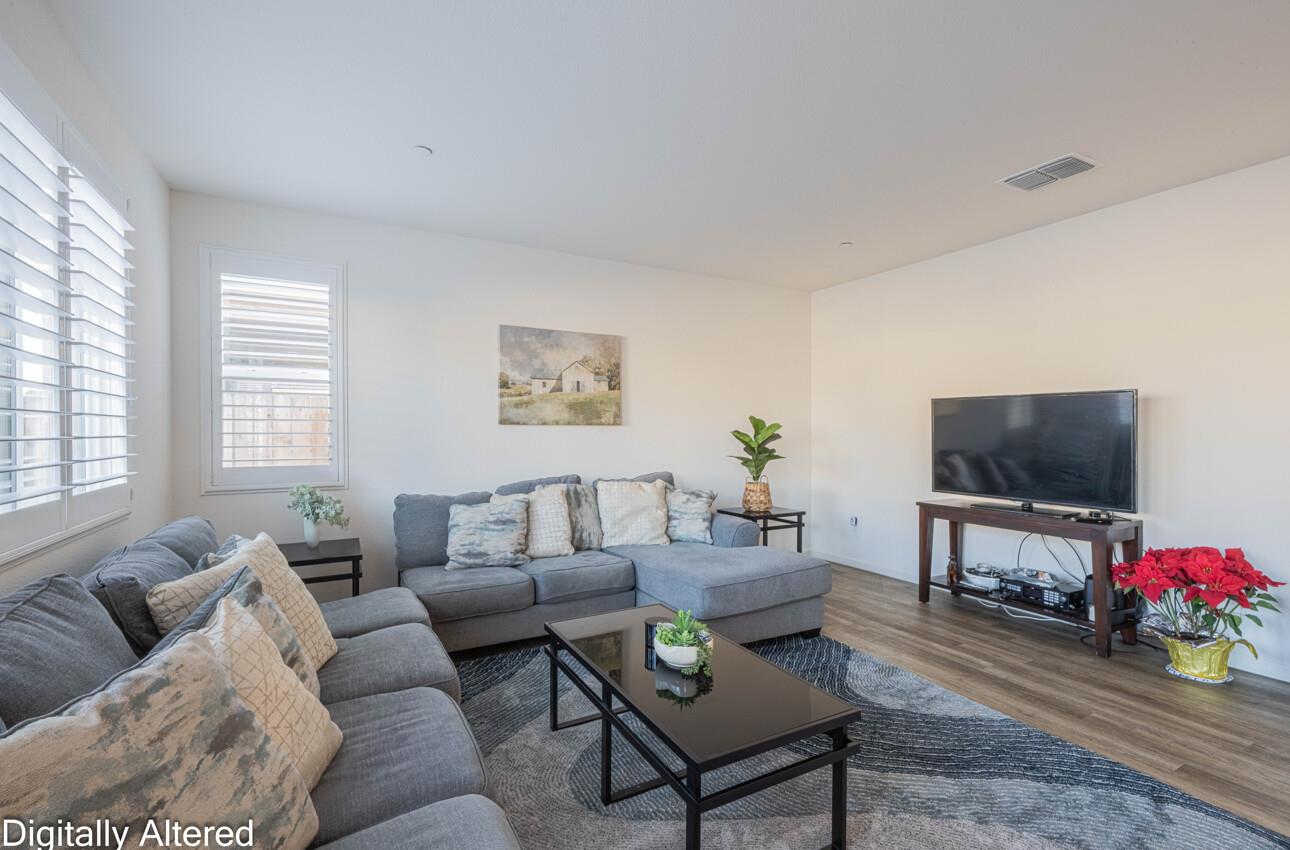 570 Tankersley Street Soledad, CA 93960 - Photo 10 of 64 a living room with furniture a flat screen tv and a window