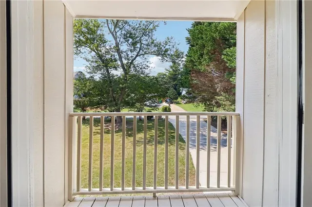 a house that has a tree in front of it