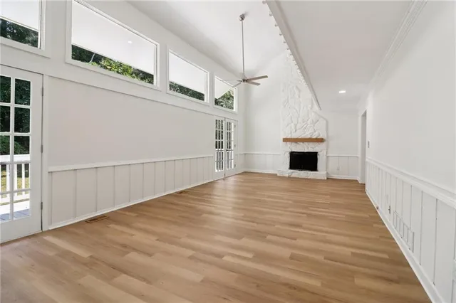 a view of an entryway with wooden floor