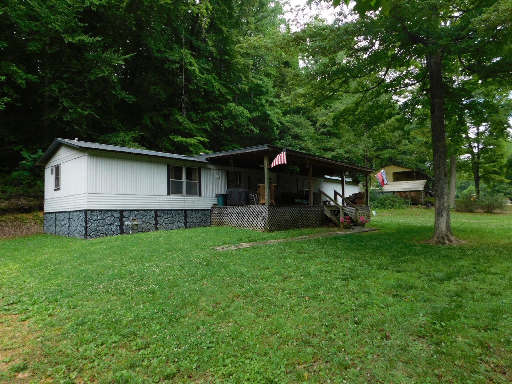 107 Haylee Road Waverly, TN 37185 - Photo 3 of 49 a view of a house with backyard