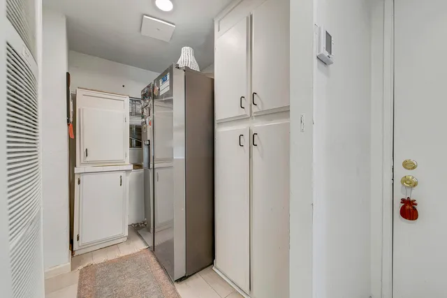 a view of a dining room with furniture and window