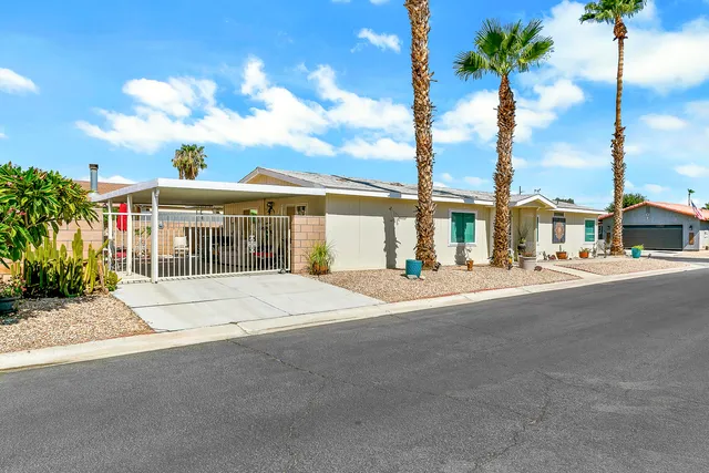 a view of a dining room with furniture and window