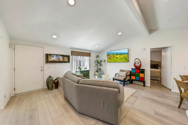 a living room with furniture fireplace and a flat screen tv