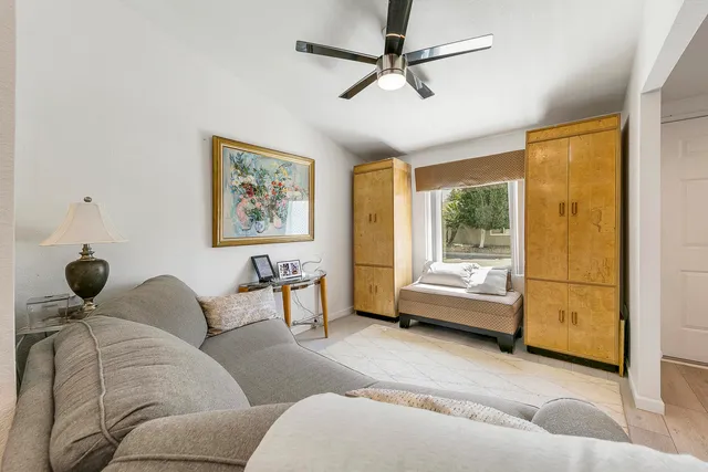 a kitchen with granite countertop a refrigerator and a sink