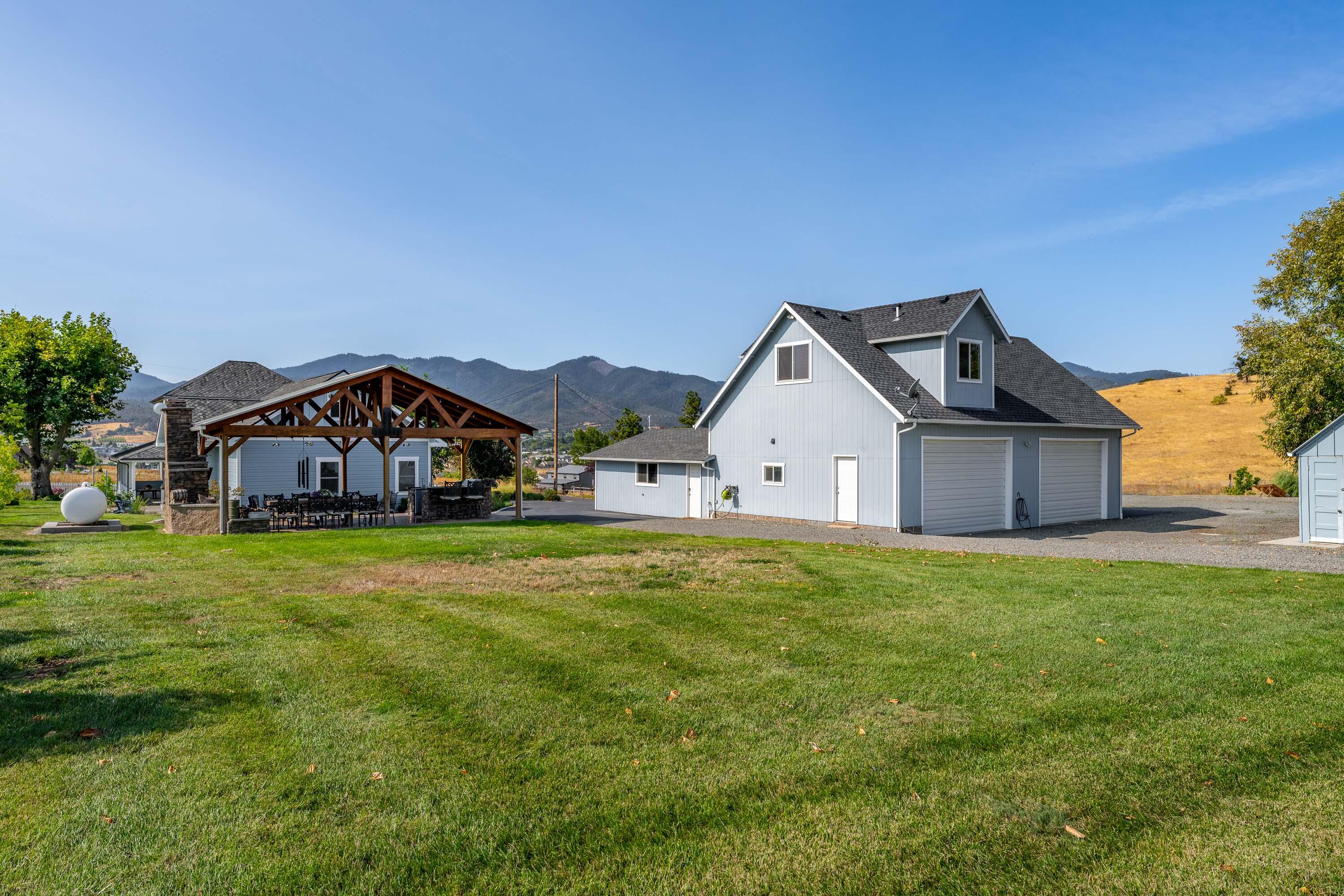 995 Suncrest Road Talent, OR 97540 - Photo 61 of 96 a front view of a house with a yard and garage