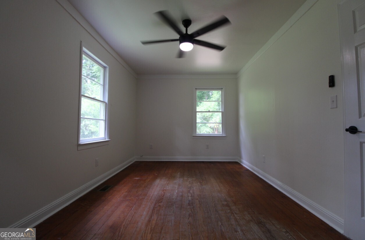 8142 Alabama Highway Rome, GA 30165 - Photo 8 of 10 wooden floor in an empty room with a window