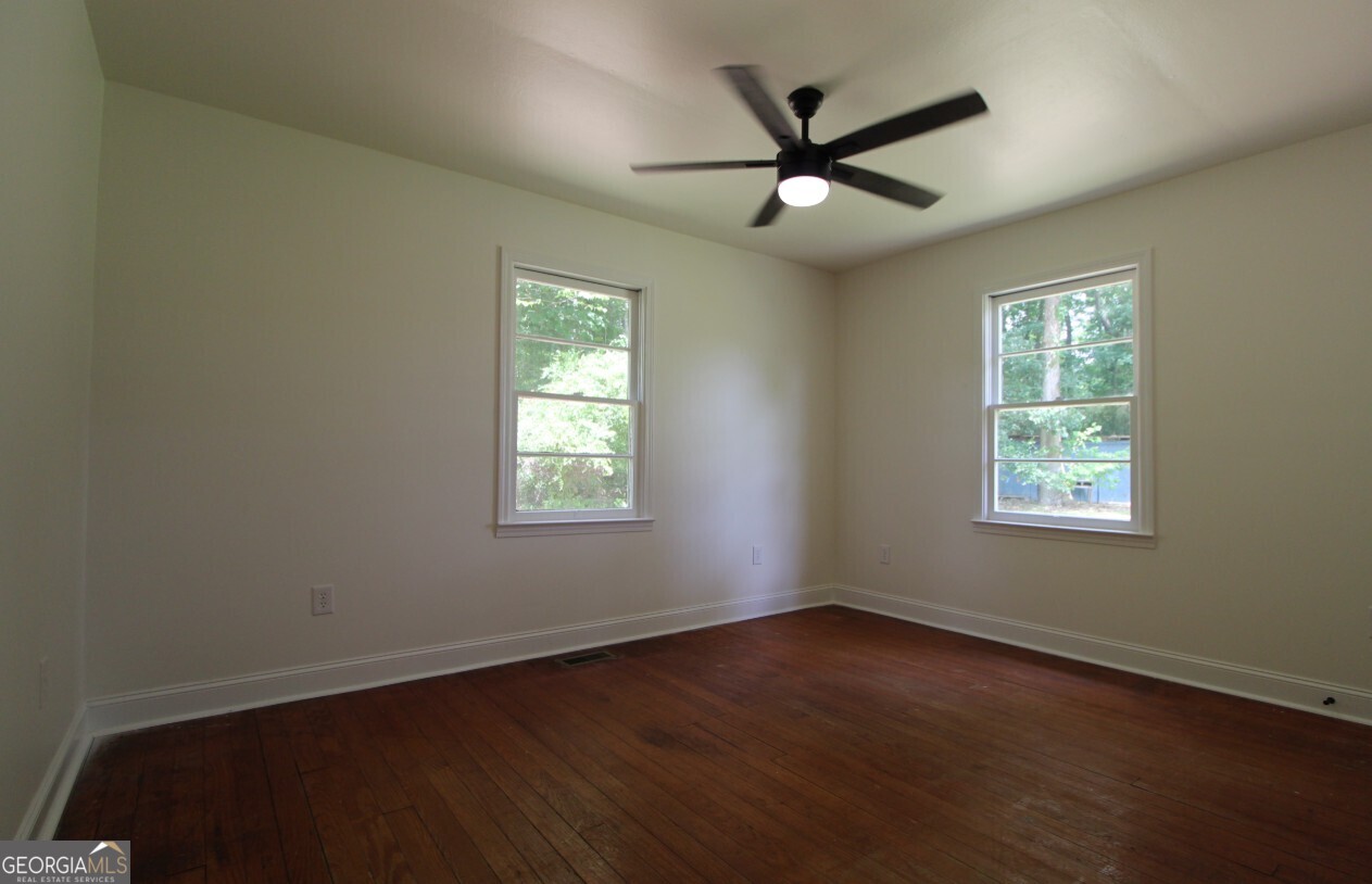 8142 Alabama Highway Rome, GA 30165 - Photo 9 of 10 a view of a livingroom with a ceiling fan and window