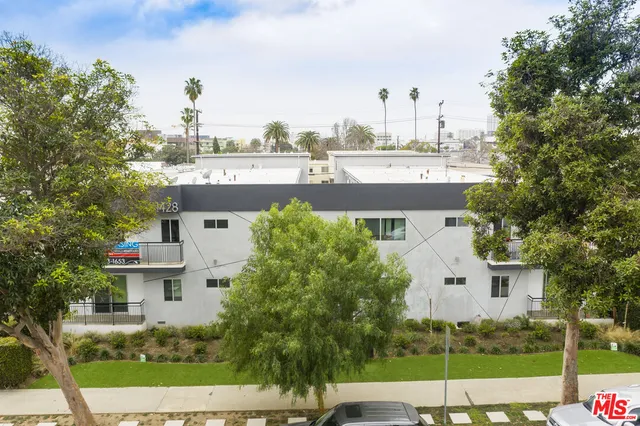 a view of a house with a yard and plants
