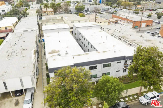 an aerial view of a house with a swimming pool