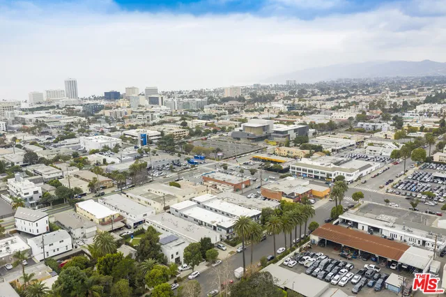 an aerial view of residential building and parking space