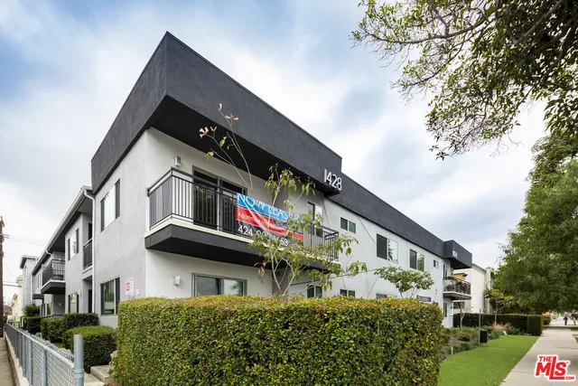 a front view of a building with glass windows