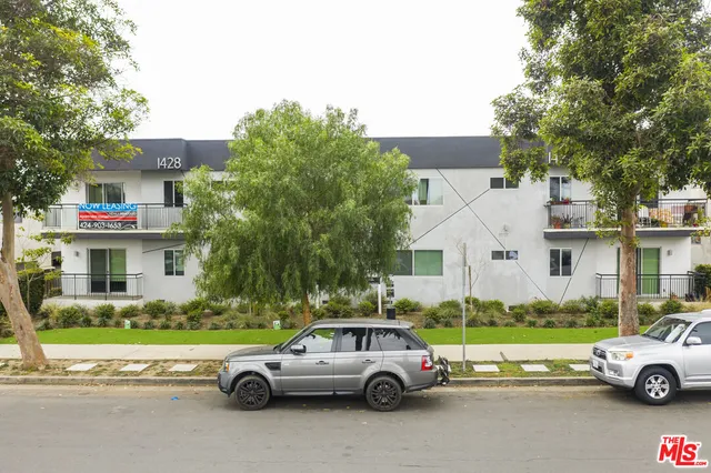 a view of a cars parked in front of a house