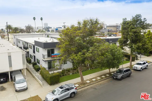 a view of a city that has parked cars