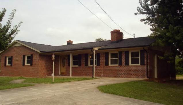 135 Sandy River Road Axton, VA 24054 - Photo 1 of 7 a view of a house with a yard plants and large tree