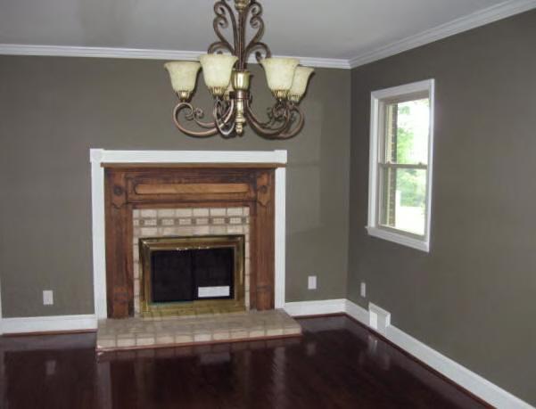135 Sandy River Road Axton, VA 24054 - Photo 2 of 7 a view of fireplace and window in a room