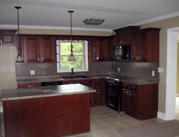 135 Sandy River Road Axton, VA 24054 - Photo 5 of 7 a kitchen with stainless steel appliances granite countertop a sink a stove and a refrigerator
