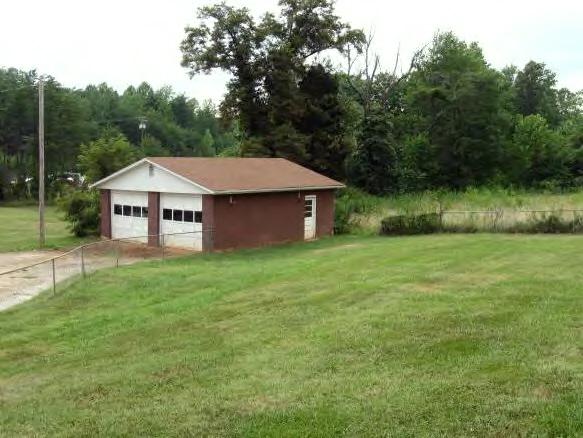 135 Sandy River Road Axton, VA 24054 - Photo 6 of 7 a aerial view of a house next to a big yard and large trees